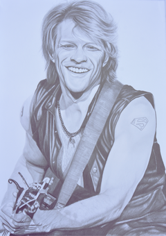 A meticulously detailed graphite portrait celebrating Jon Bon Jovi, the charismatic frontman of the iconic rock band Bon Jovi. Known for anthems like Livin’ on a Prayer and Always, he has become a symbol of 1980s and ’90s rock, blending powerful vocals with timeless stage presence. This artwork captures his unmistakable energy, from the confident expression to the rock ’n’ roll style that has inspired fans for decades.